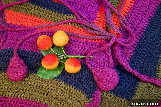 Colorful pom-pom garland strung across a wall