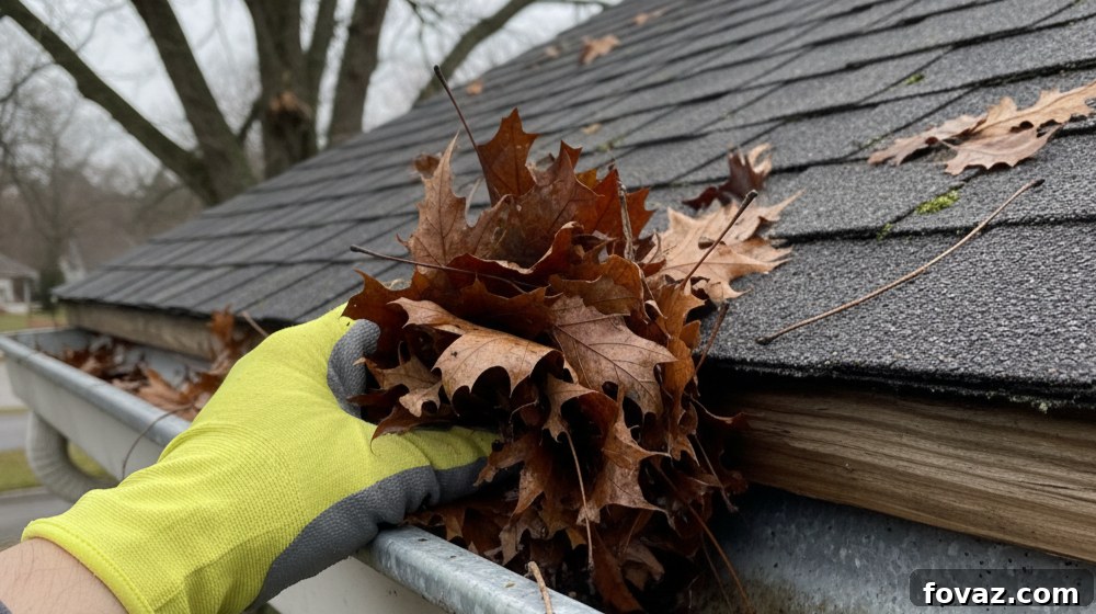 Clean your gutters to prevent winter damage and ice dams