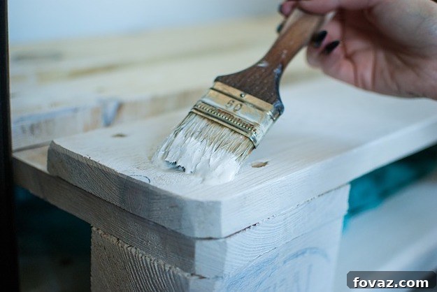 Stylish Pallet Wall on a Budget 2 Whitewash Pallet Wall Application