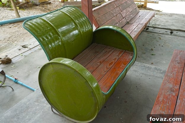 Upcycled drum turned into a cozy bench with recycled wood and rubber linings.