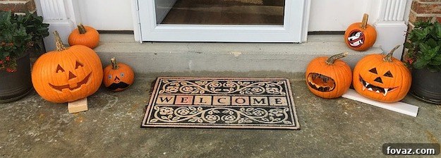 DIY door mat made from an old yoga mat cut in half, placed at an entryway