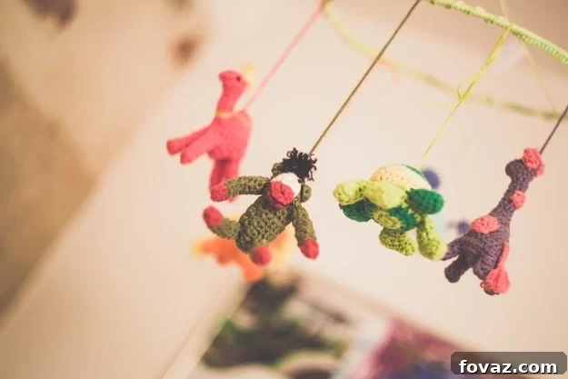 Sports-themed baby mobile with various balls