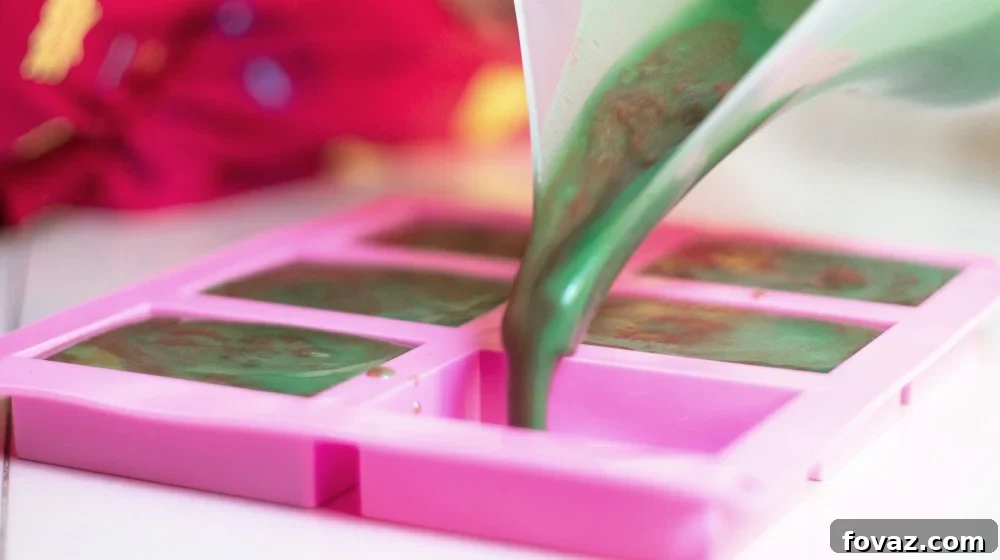 pouring green soap mix into mold | DIY Shamrock Shake Bath Bomb And Soap For A Relaxing St. Patrick’s Day | shamrock shake | how to make a shamrock shake