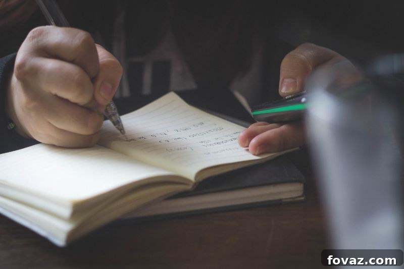 person writing notes | Homebrewing Guide: Everything You Need To Know Before Brewing Your First Beer 