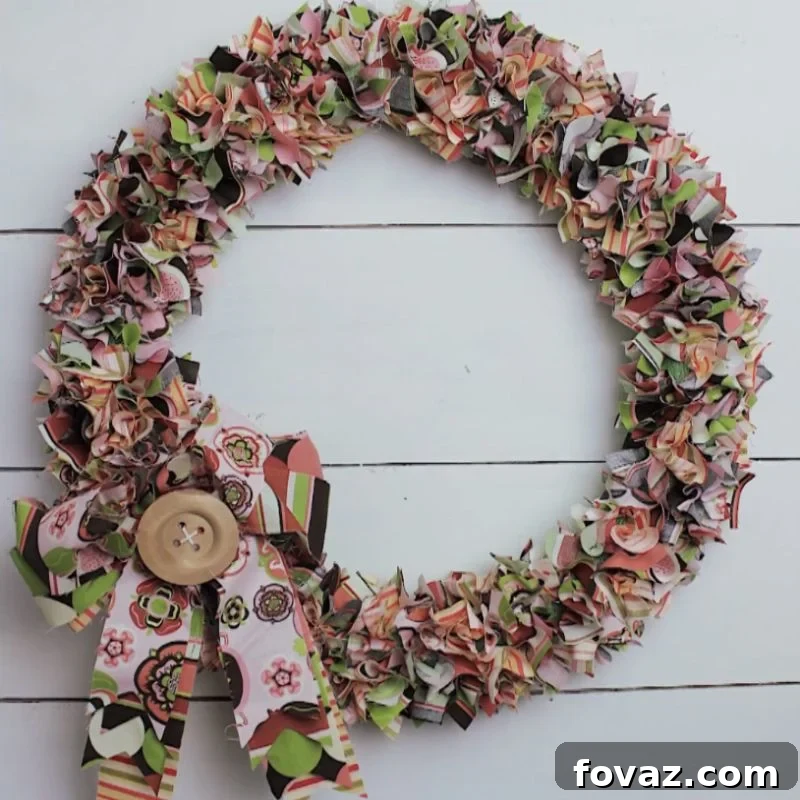 Stunning DIY Fall Fabric Wreath Made with Fabric Strips and a Wooden Button Accent