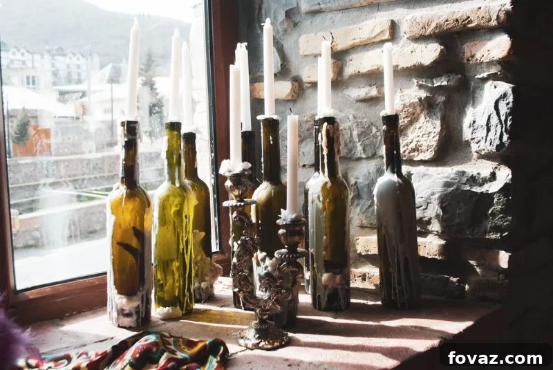 Elegant white candles in repurposed glass wine bottles used as DIY candle holders