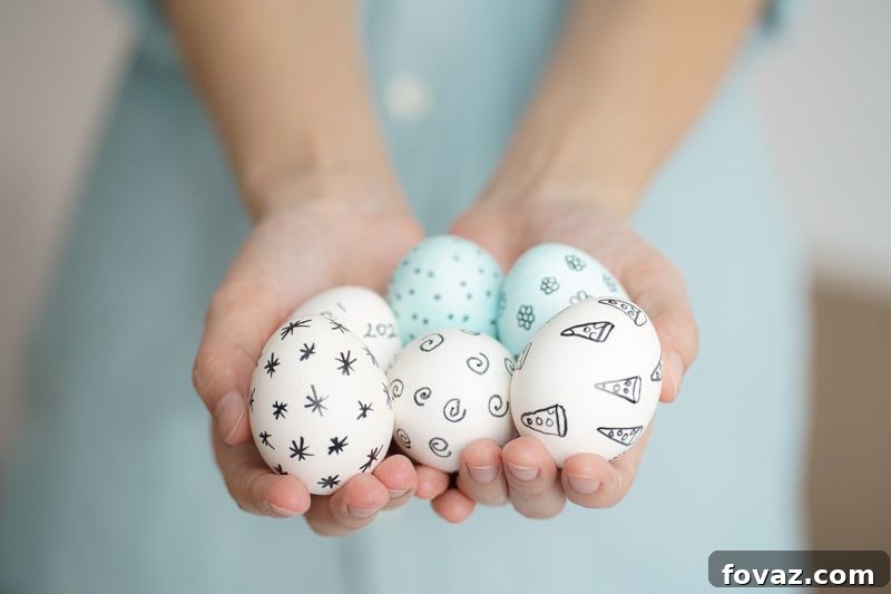 10 Fun and Easy DIY Easter Egg Crafts 2 holding-easter-eggs-handdrawn-patterns-soft | diy egg art