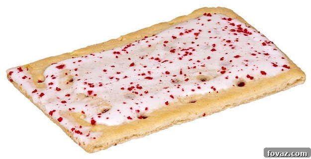 Craft Your Own Homemade Pop Tarts 2 Freshly baked homemade pop tarts with colorful glaze and sprinkles on a wooden board.