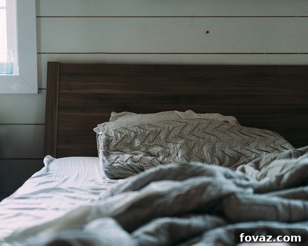 From Scraps to Sanctuary Your Reclaimed Wood Headboard 2 Stunning reclaimed wood headboard mounted in a rustic bedroom setting