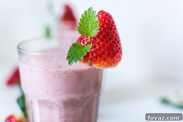 A vibrant green detox smoothie, bursting with fresh ingredients, ready to energize your day and boost overall wellness.