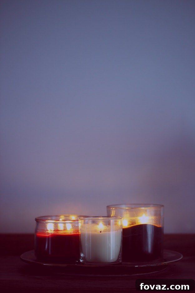 Craft Your Own Paper Flower Candle Holders 2 Beautifully crafted DIY paper flower candle holder with a glowing candle, adding warmth and elegance to the room.