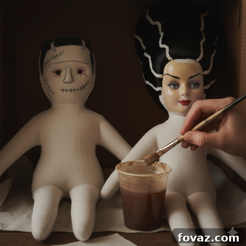 Sew Your Own Spooky Sweethearts Frankenstein Cloth Dolls 13 Applying a diluted brown paint wash to give the fabric dolls an aged, vintage look, then blotting excess