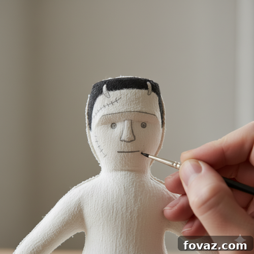 Sew Your Own Spooky Sweethearts Frankenstein Cloth Dolls 8 Tracing eyes and a simple vertical line for Mr. Frankenstein's lips, defining his iconic facial features