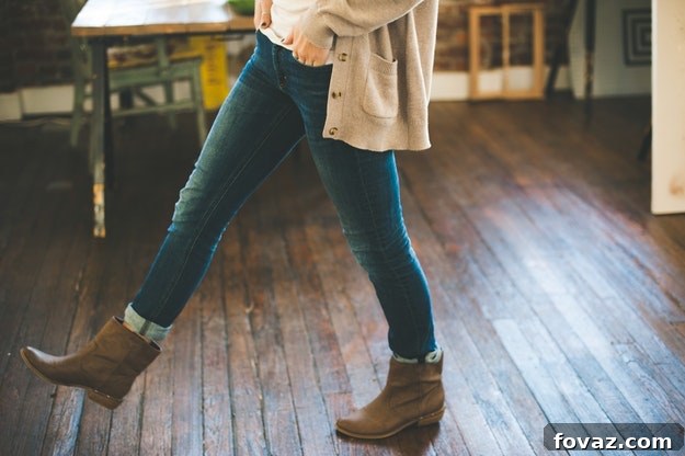 Creative DIY Trends for Chic Living 2 A chic woman showcasing a DIY fashion trend, possibly deconstructed shirt or patched denim, blending runway inspiration with everyday wear.
