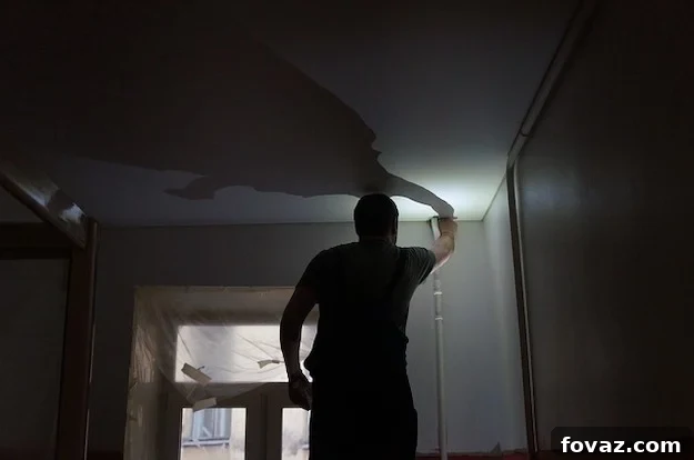 Recessed lighting trim being installed into the ceiling